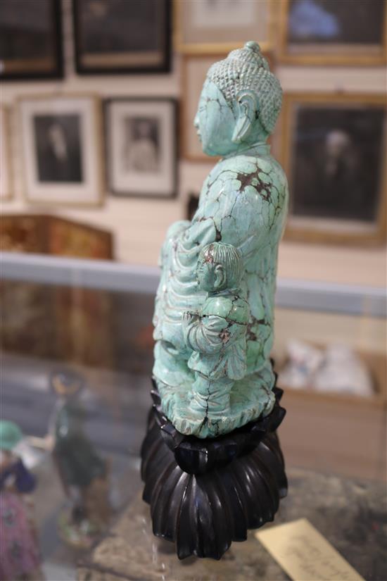 A Chinese turquoise matrix group of a buddha and attendants, circa 1900, 6.75in. 9in. overall